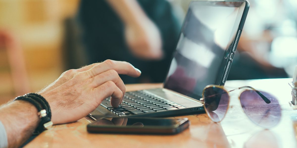 Writing a blog post on a laptop